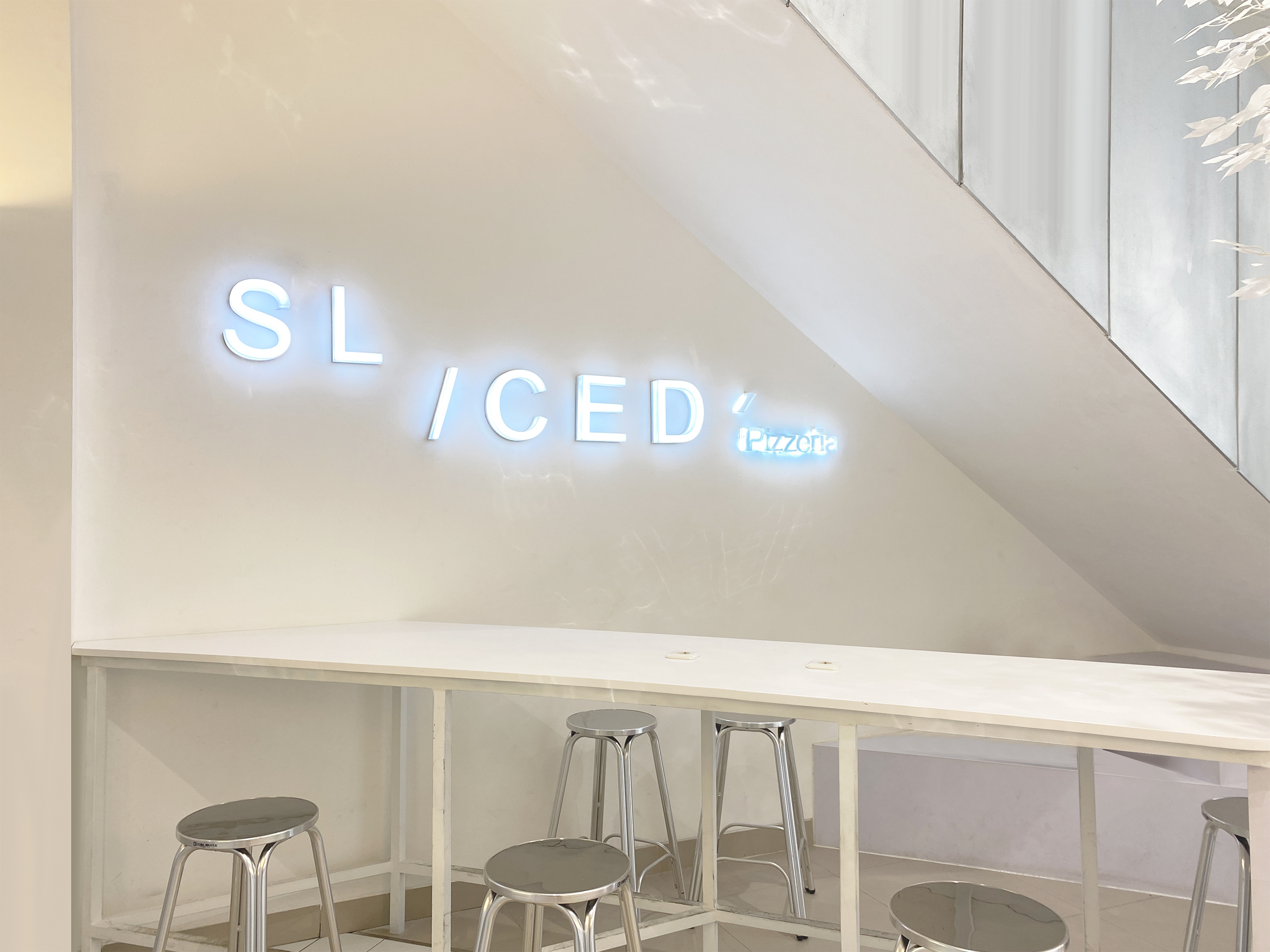 A Distinctive Pizza Restaurant Covered in White Hue