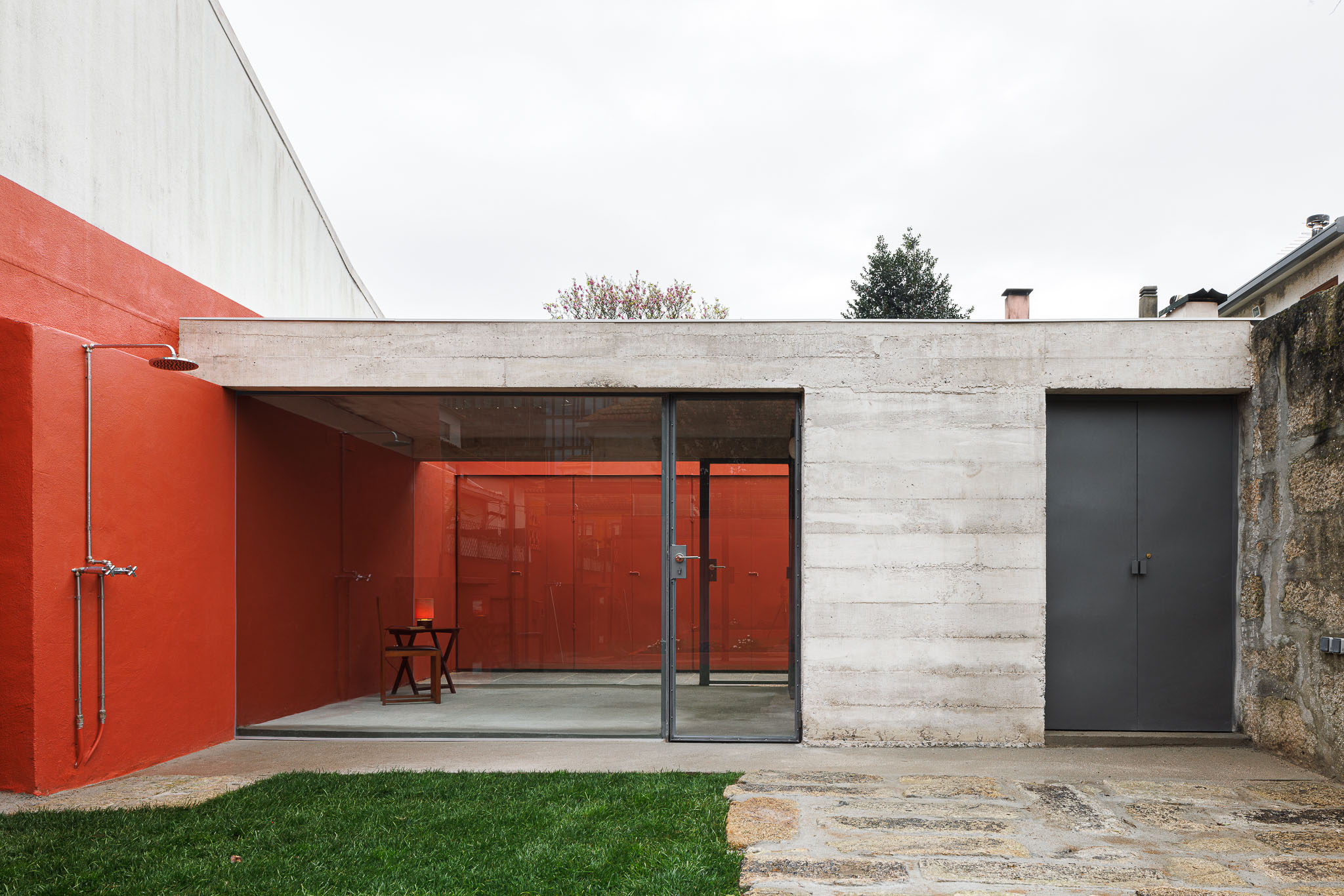 A Concrete Structure with A Spark of Bright Red Hue