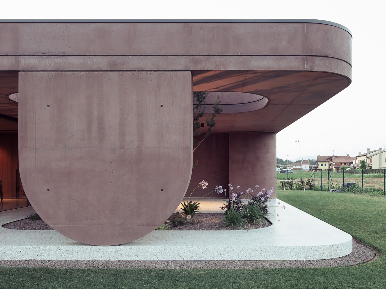 Romantic Serenity: Embracing Sweetness in the Light Red Concrete House