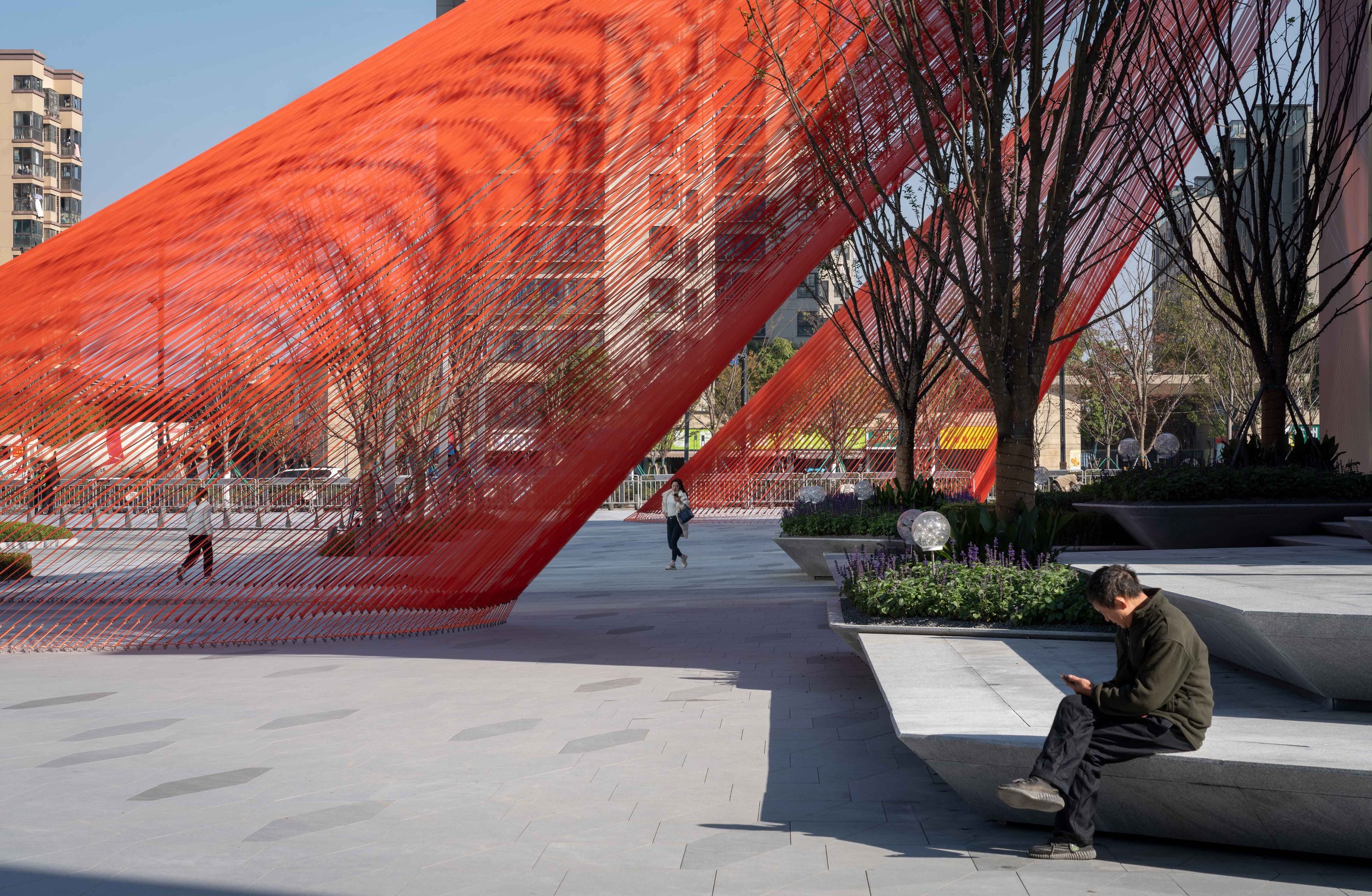 Another Behin Ha’s Orange Ribbons Stretching Downwards in a Mixed-use Complex in Hangzhou