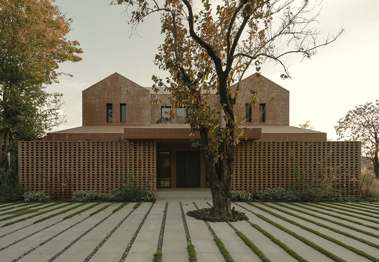 Studio KiKi ARCHi redesigns Anna Garden House into a pared-to-the-red brick volume