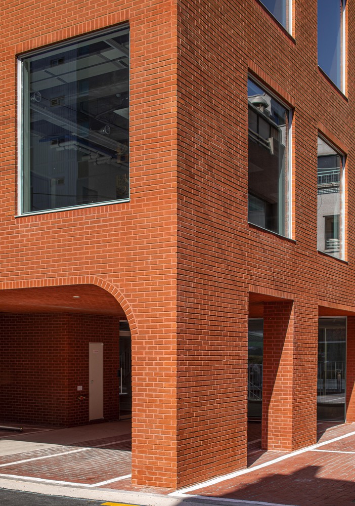 Clean lines and simple geometrics with red brick material