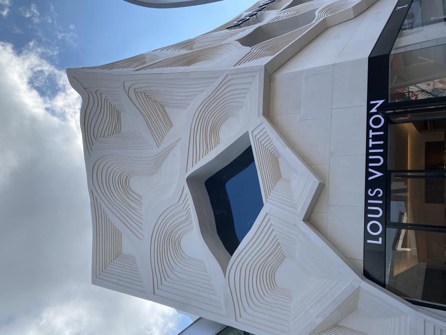 The pattern formed on this facade evokes memories of Louis Vuitton's signature 'Damier' shape