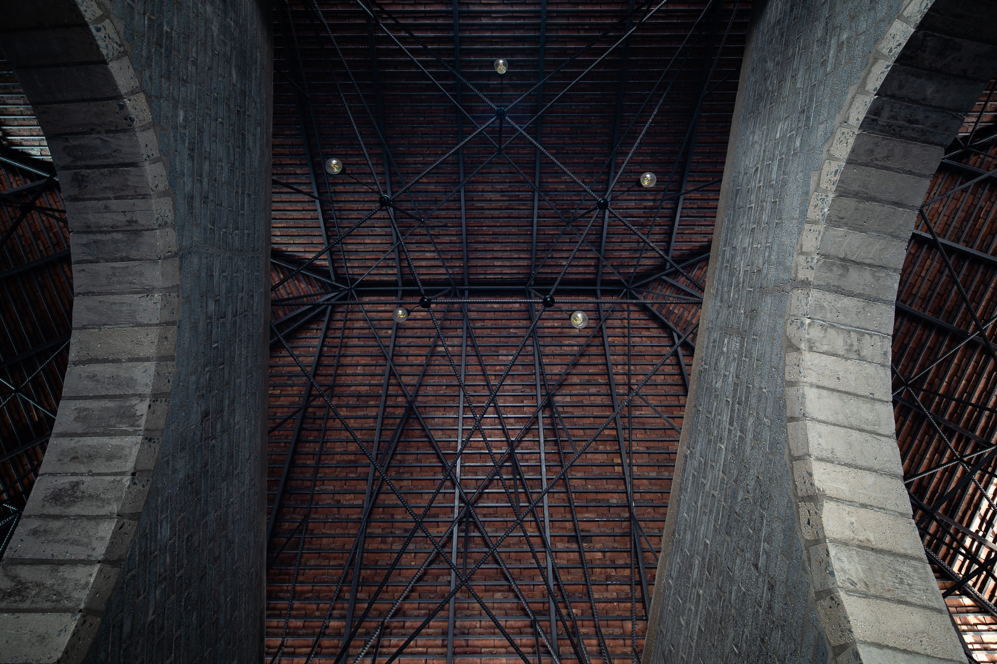 The distinctive roof is supported by a modern structural system of a sleek and sturdy steel frame