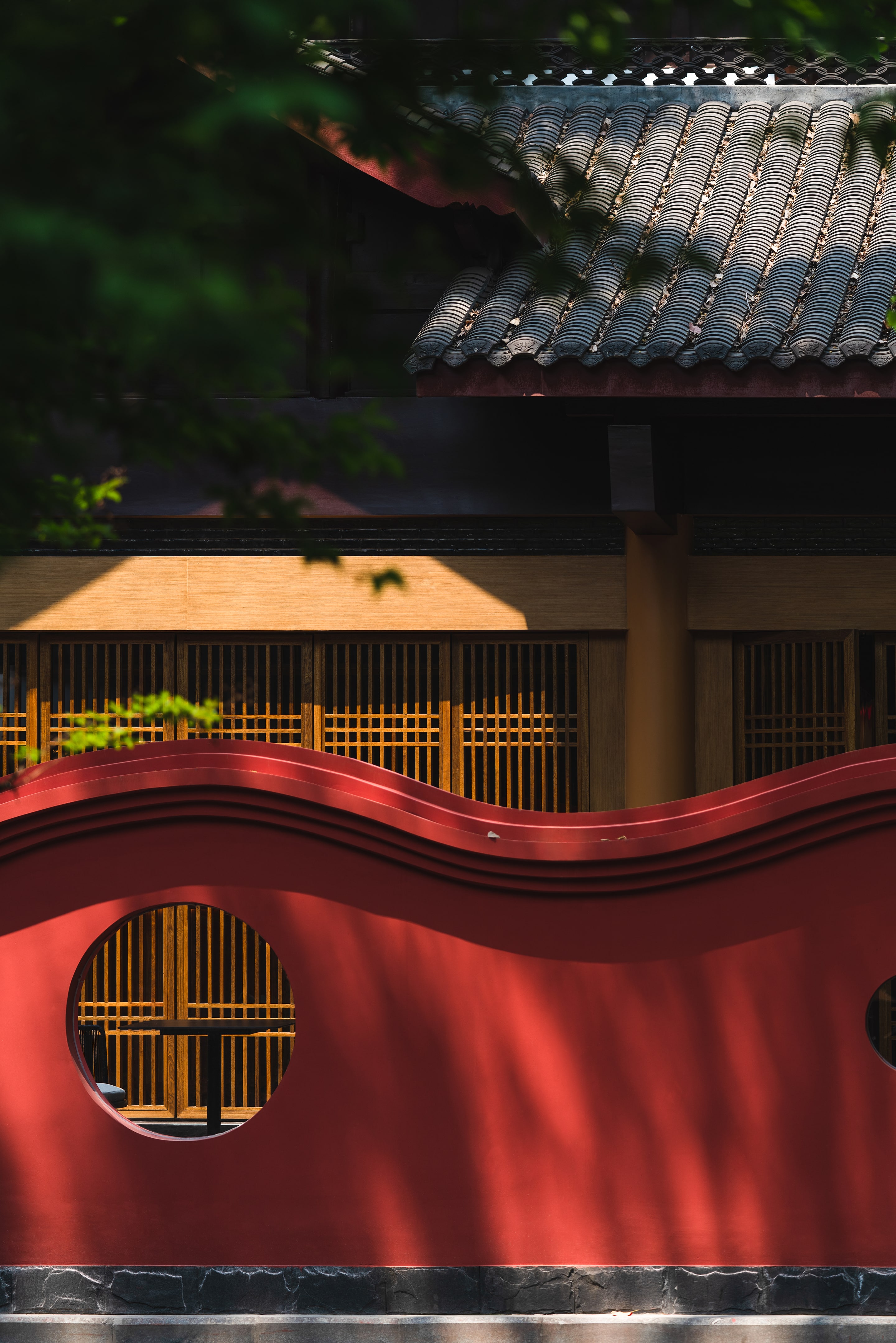 View of the tea room from Qingyang Palace through the red perforated fence