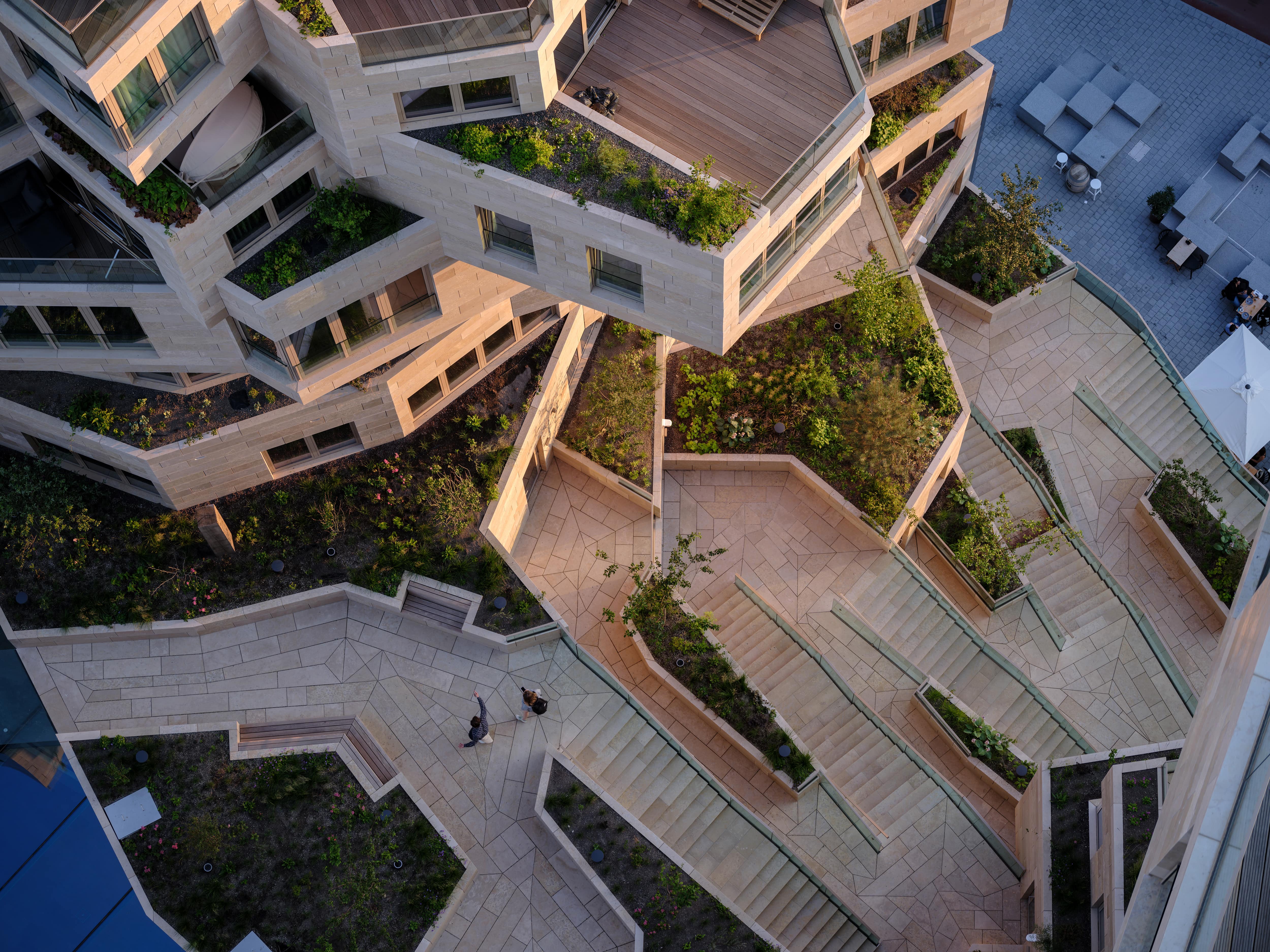 This central valley flows from the fourth and fifth levels of the building to the pedestrian path below