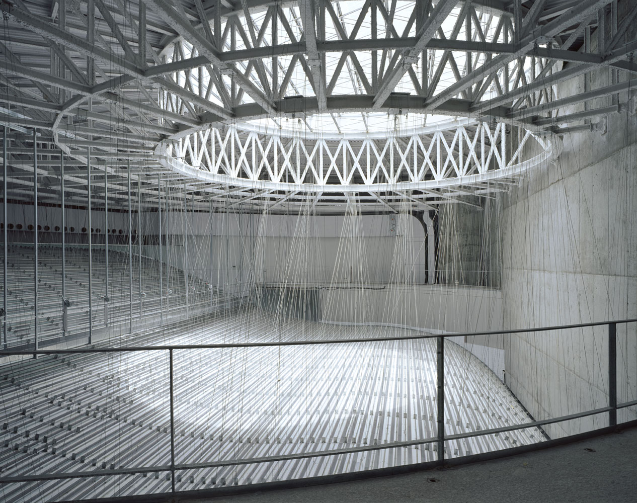 The top of the building is built with a steel frame with a large opening for natural lighting