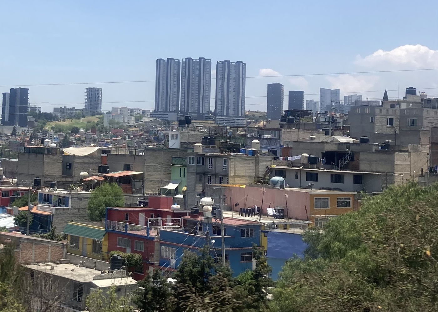 The shape of the building is very different between the original community buildings and the buildings of modern influence
