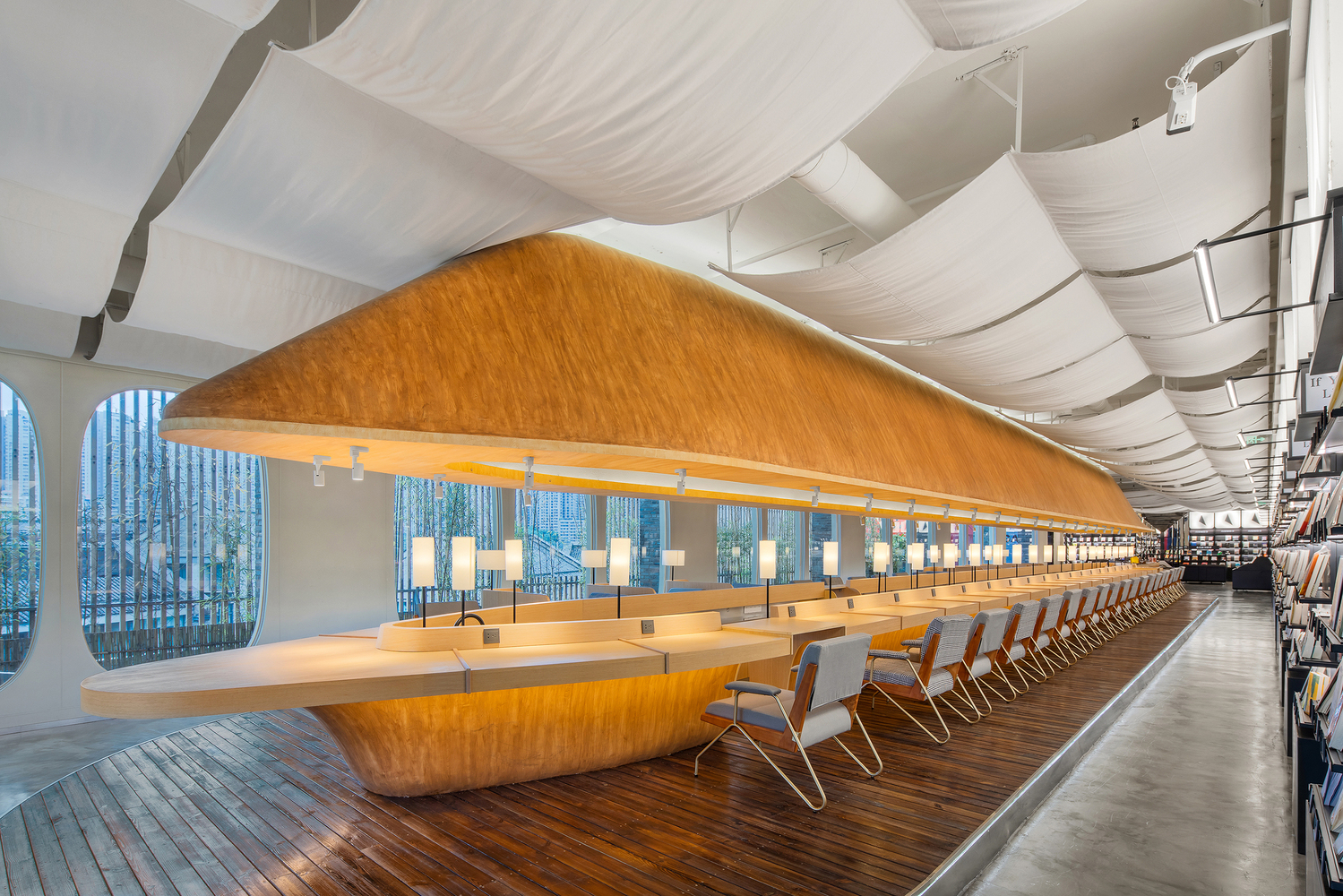 The reading area is designed with an atmosphere that brings the feeling of being reading on an spaceship