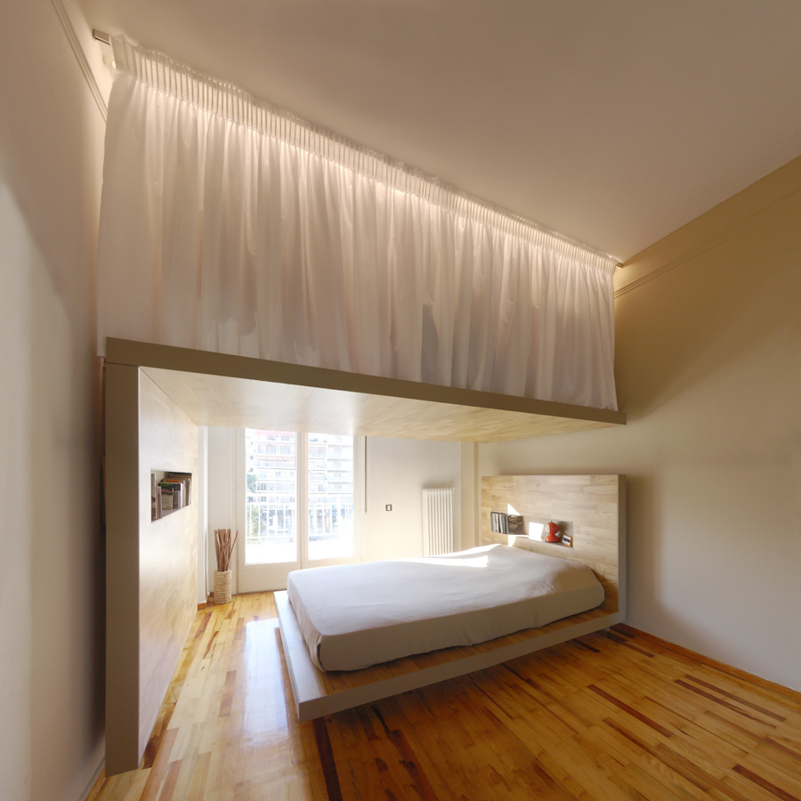 A multifunctional bed like a mezzanine with a wardrobe top