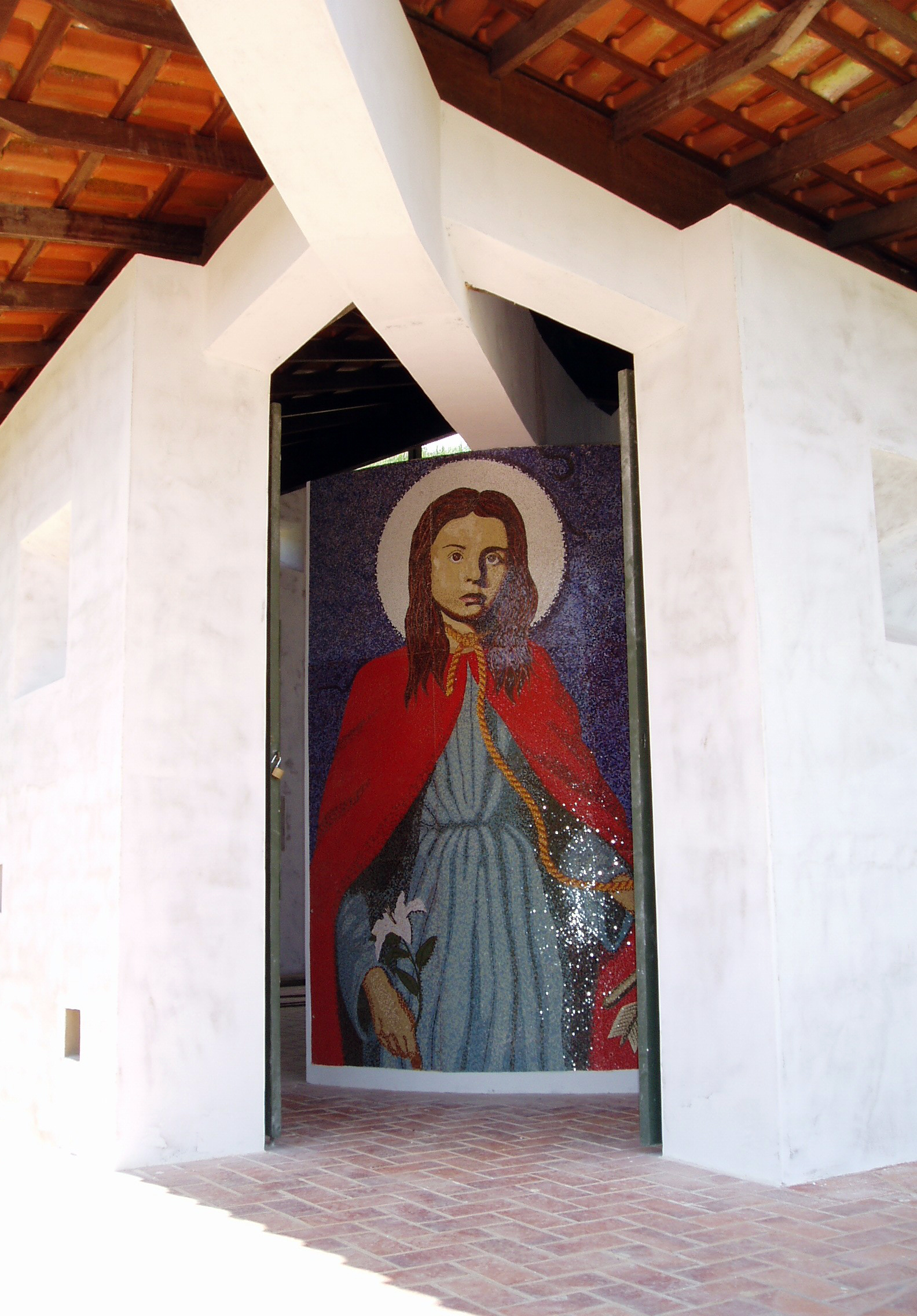 Santa Filomena Chapel entrance with a mosaic panel depicting the Saint