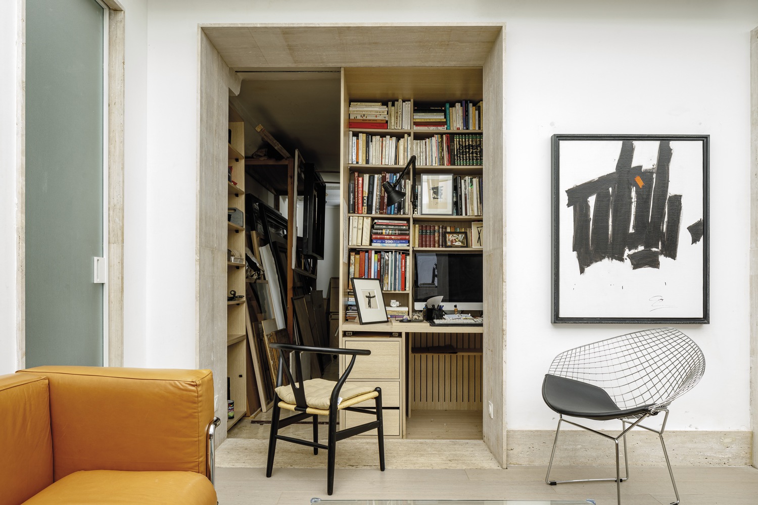 A bookcase is a hidden door for painting tools