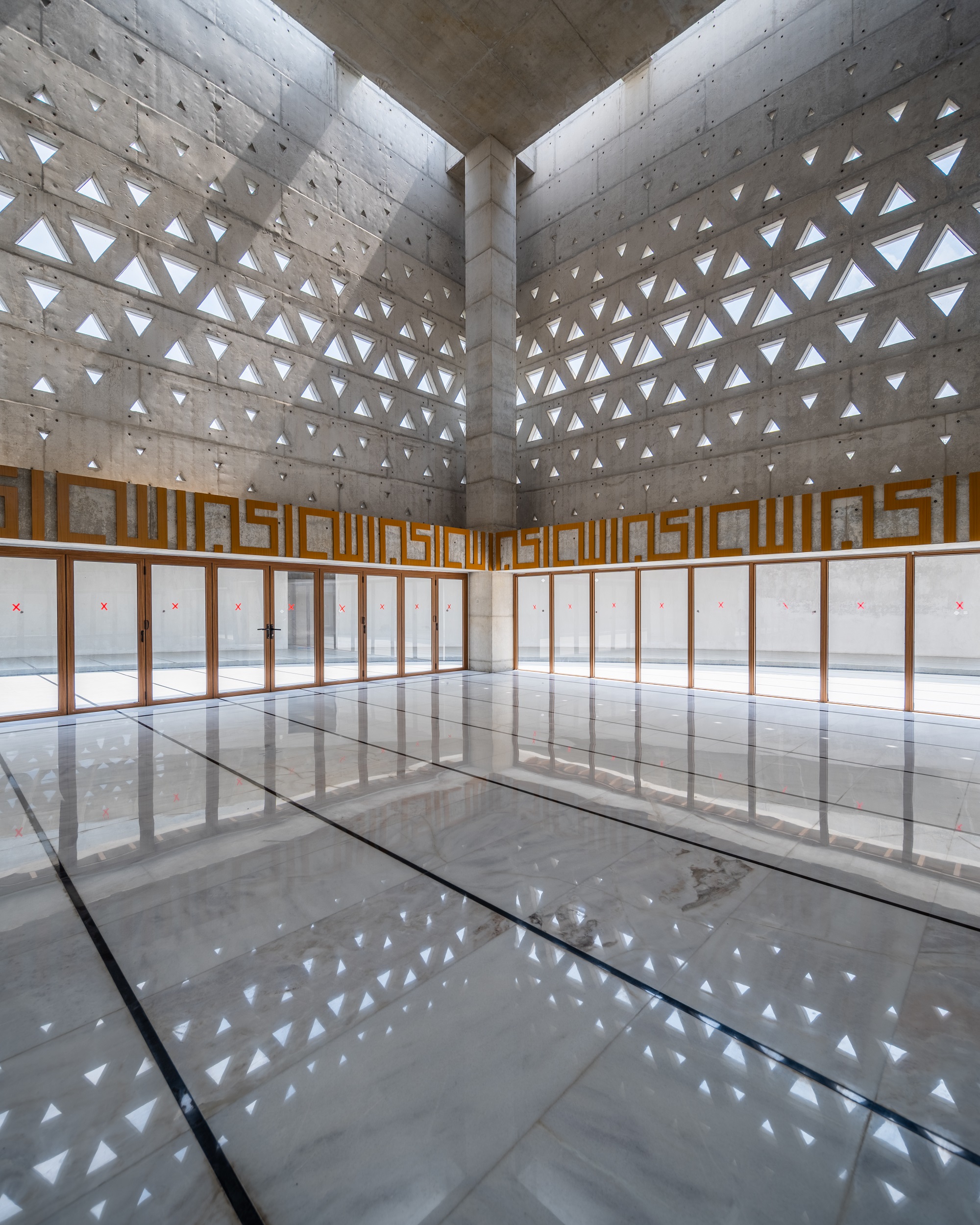 Rays of light enter through the opening in the facade of the Aman Mosque