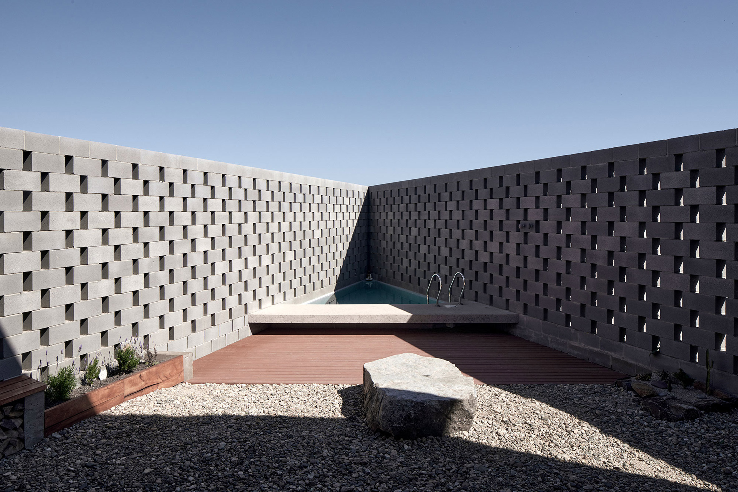 The courtyard and swimming pool are behind the V-shaped walls of the LBS house.Â (Image courtesy ofÂ CristÃ³bal Palma)