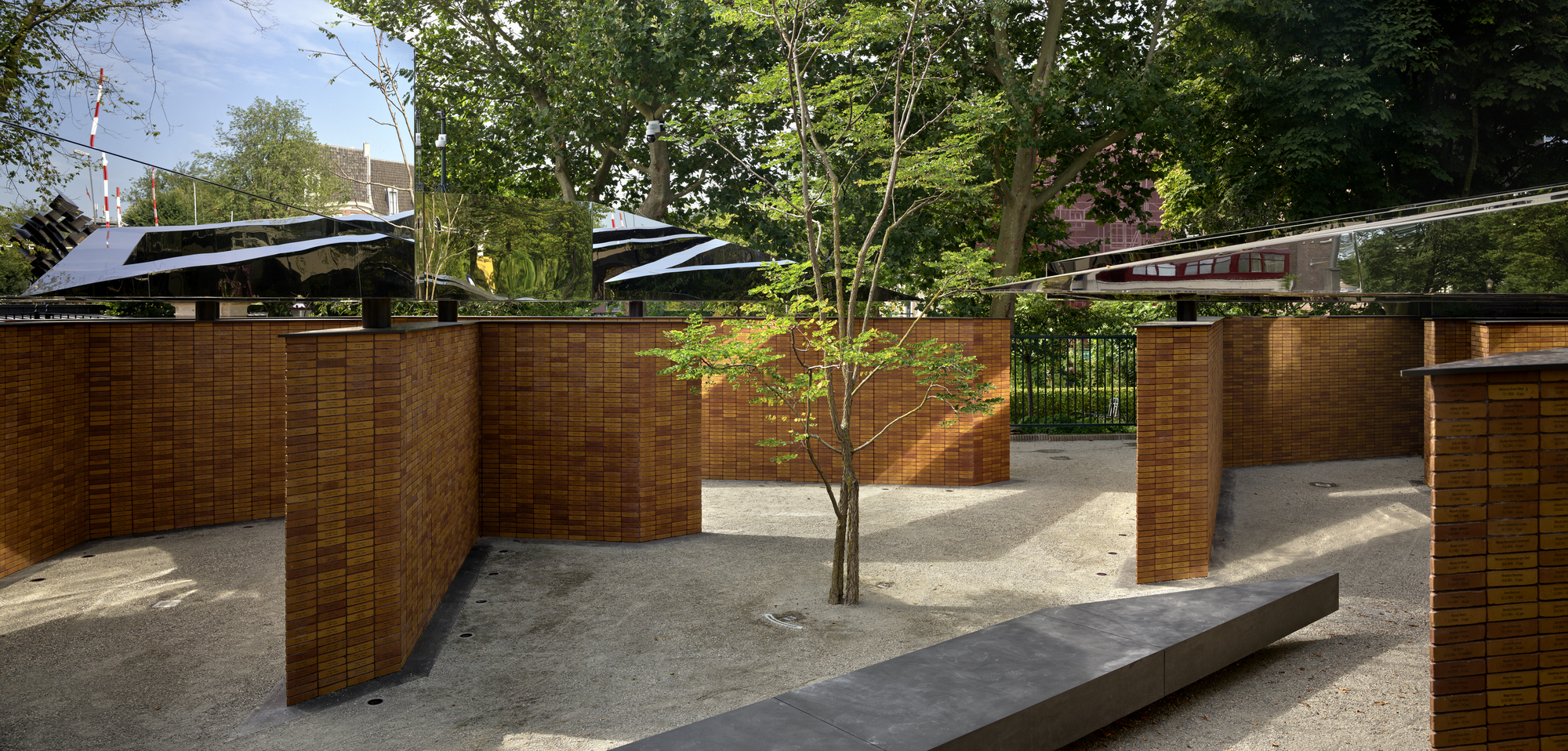 The combination of gravel, pavement, bricks, and stainless steel of Dutch Holocaust Memorial of Names