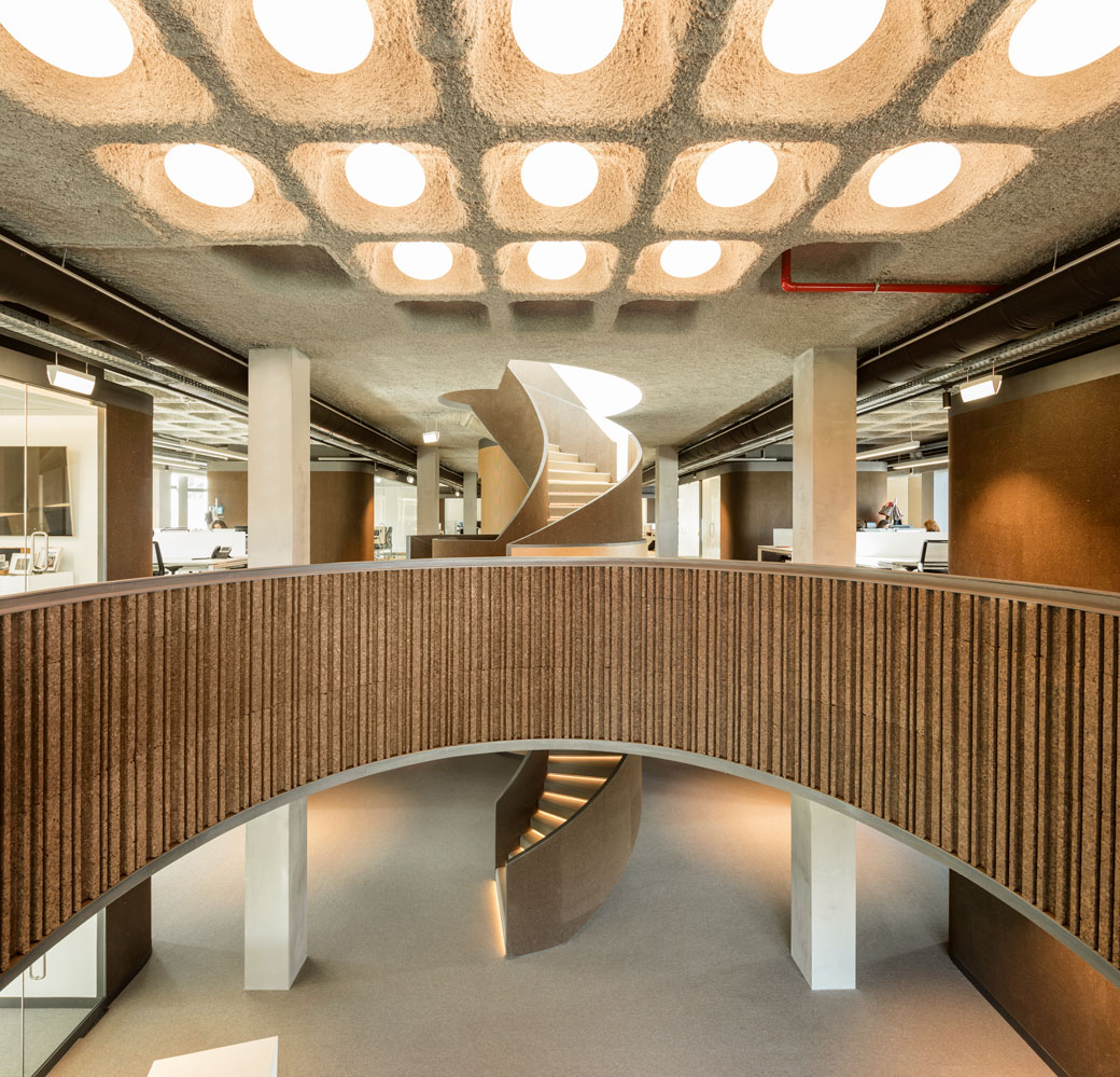 The waffle slab system, which was part of the old building structure, was retained for the interior design