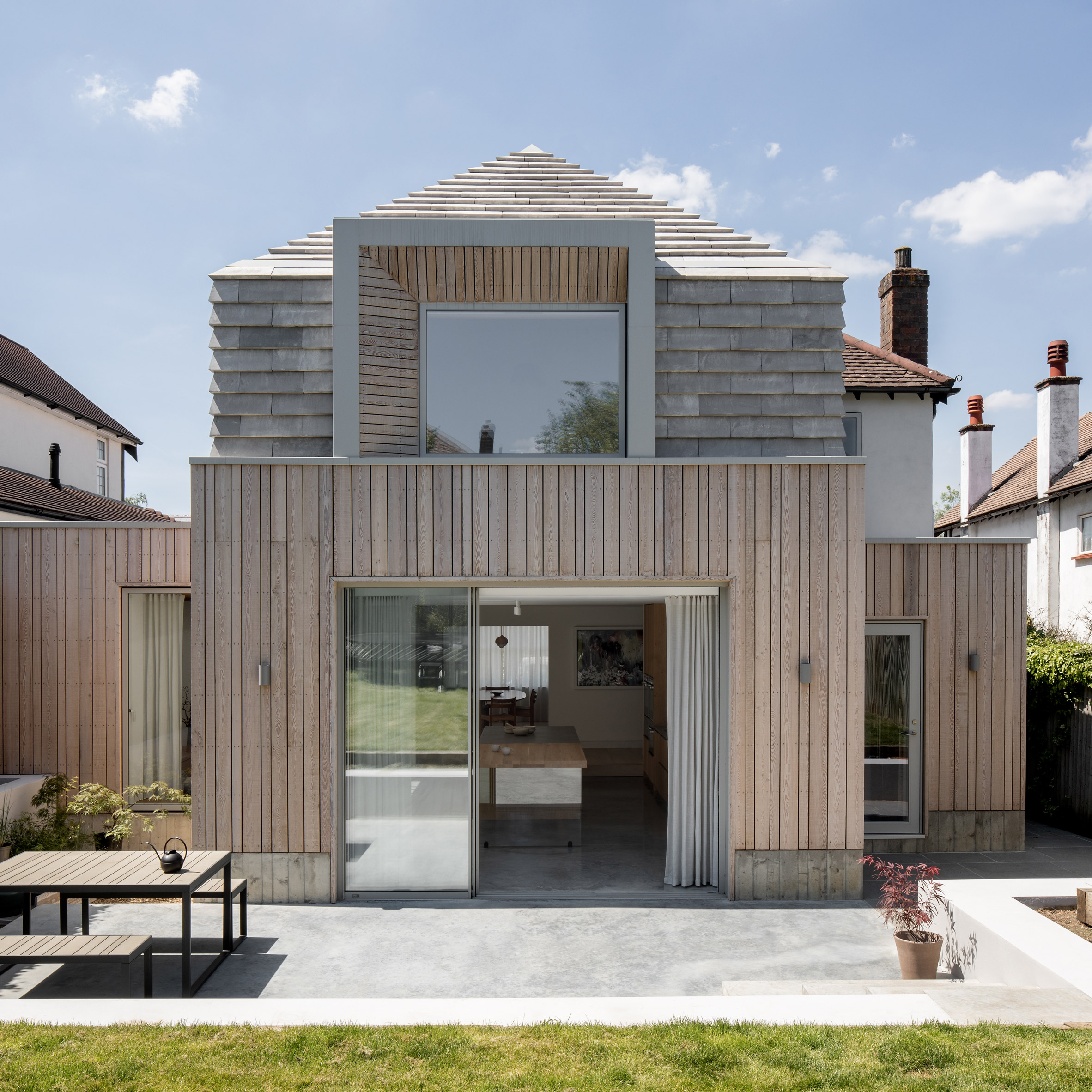 the exterior of the house with a roof made of terraced tiles arranged sloping