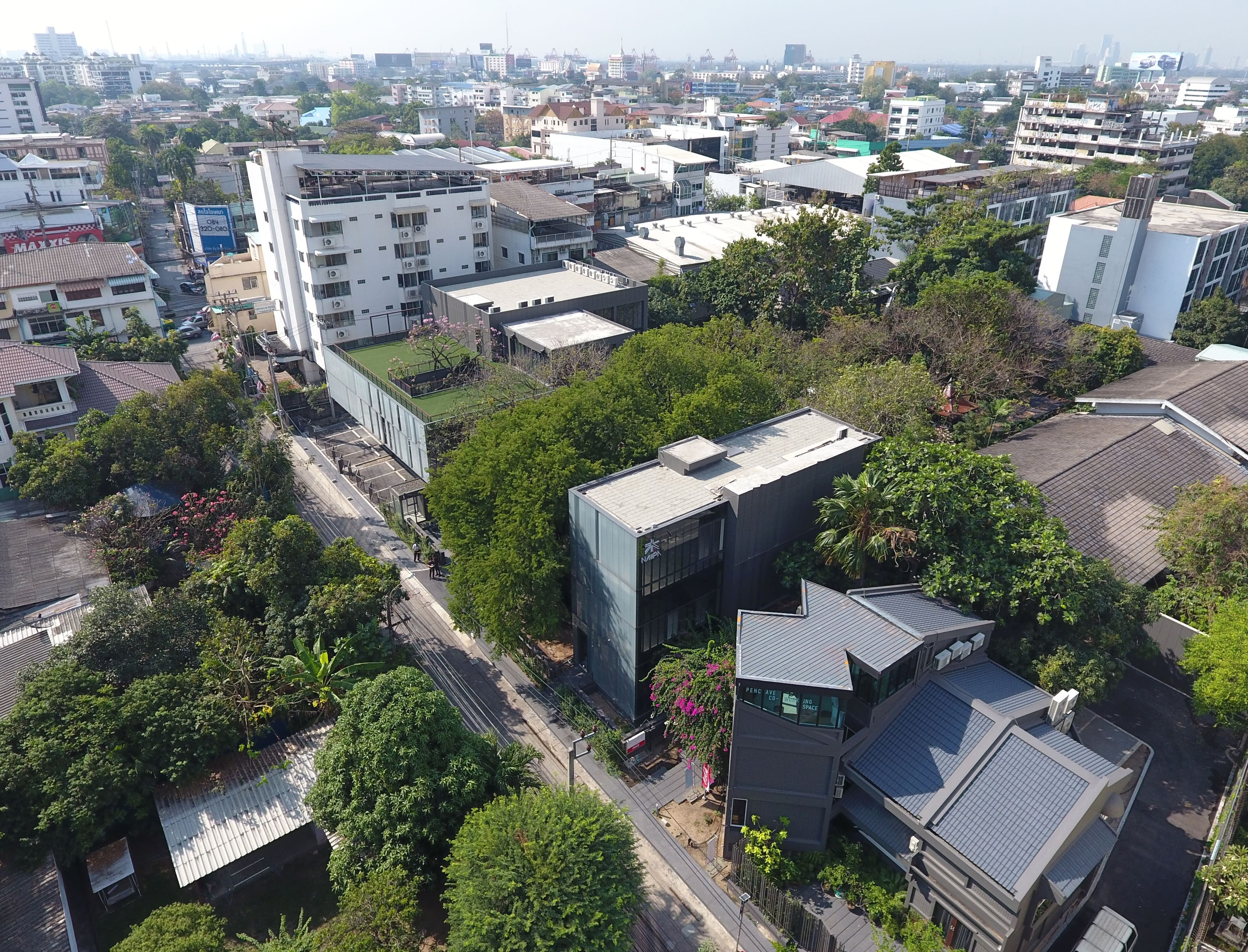 While hidden in the forest, the Naiipa Art Complex retains its urban context