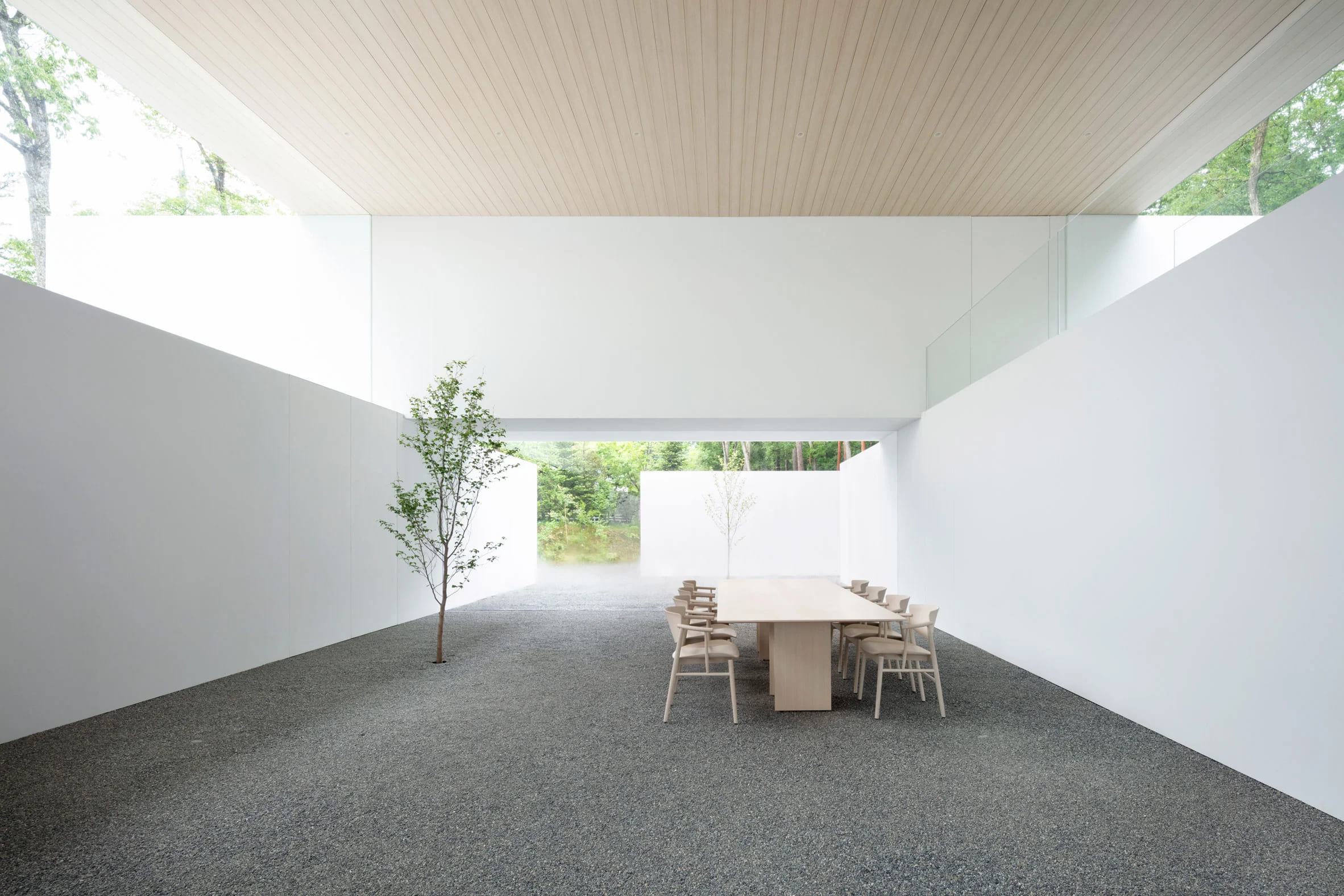 Living and dining room between two concrete tunnels on the ground floor