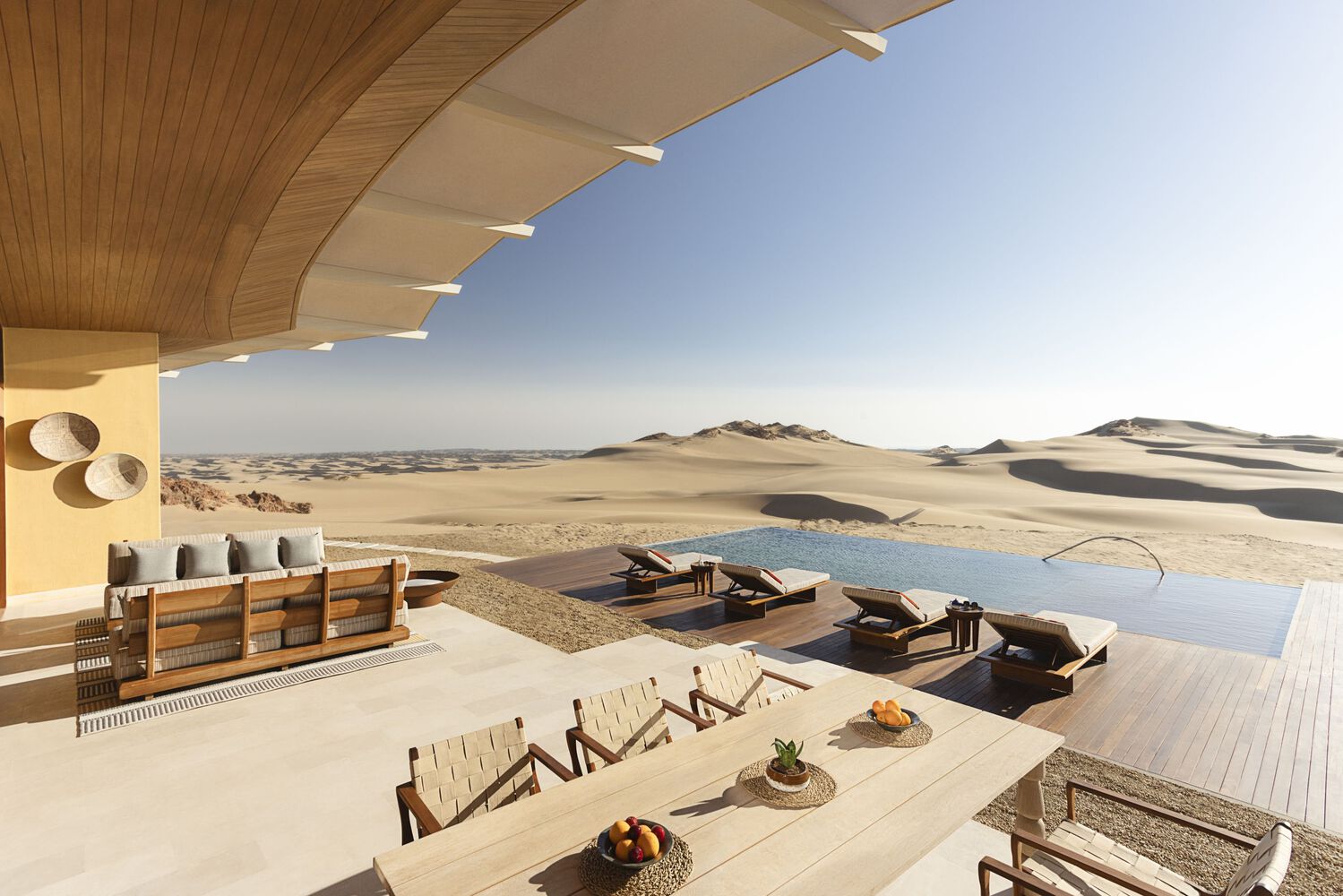 The sand-like building color of Six Senses Southern Dunes Resort