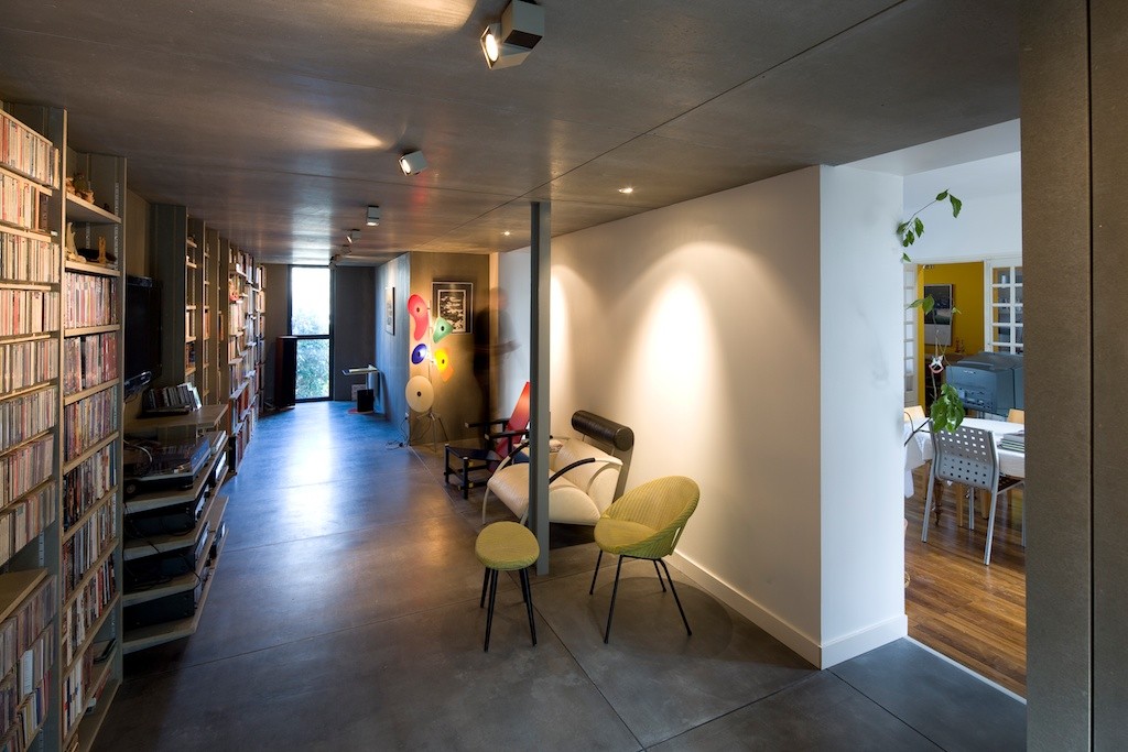 Wooden shelves serve to store the collection of homeowners