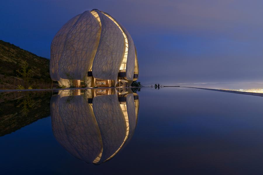 The temple of light reflected in the pool next to it (cr: doublespace)