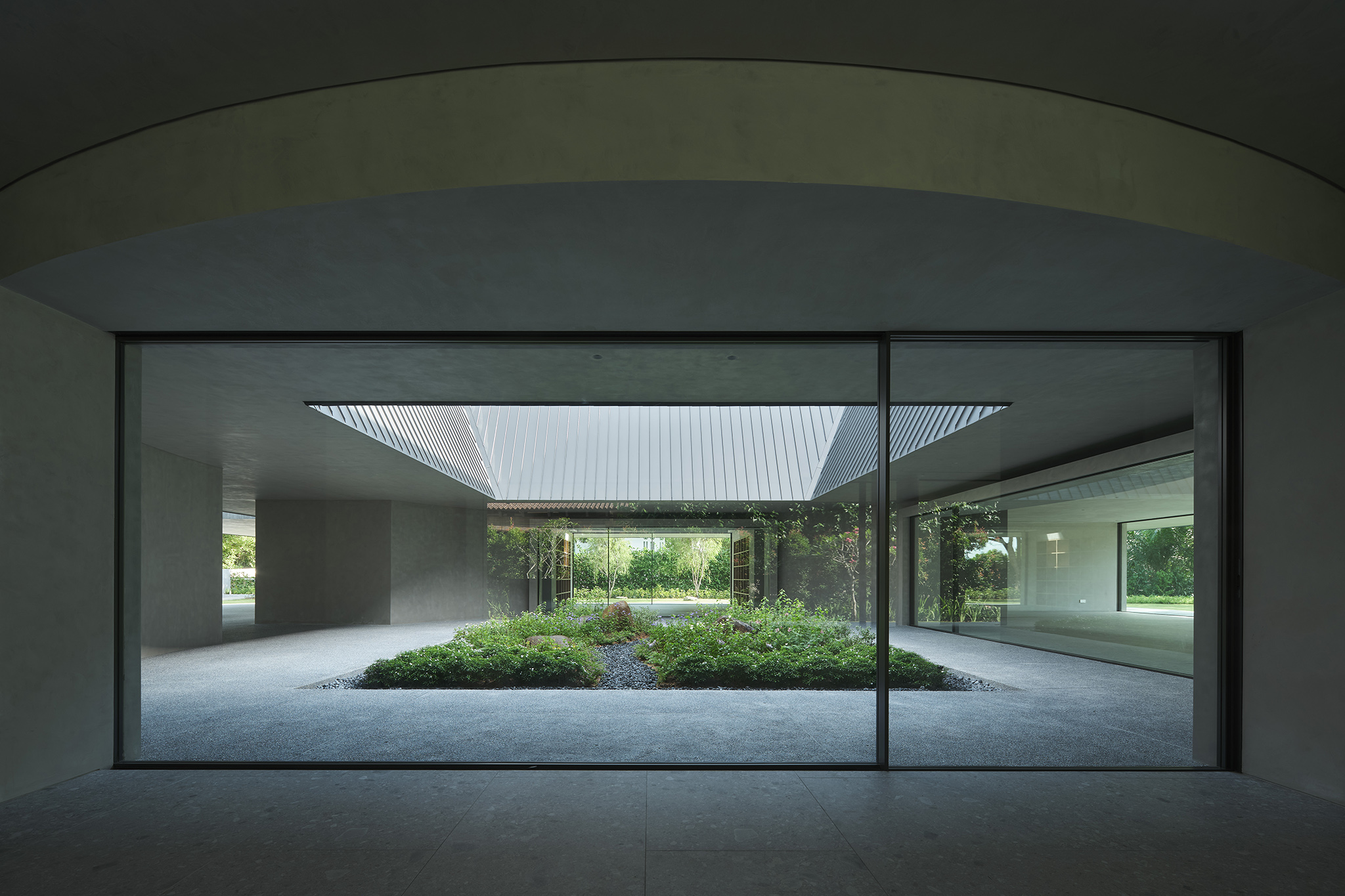 spacious glass windows and doors for visual access to the central garden