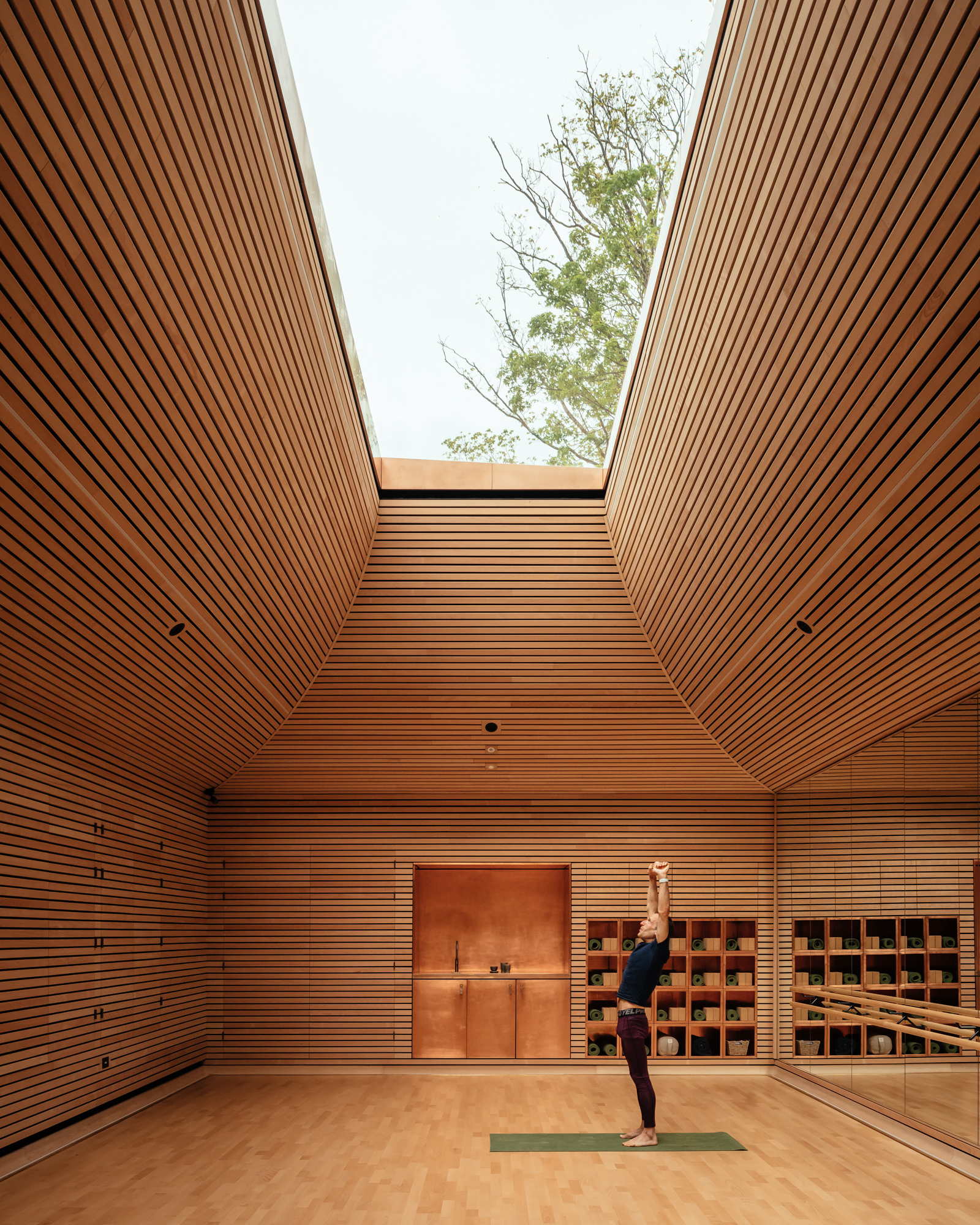 Yoga Studio interior directs attention to the sky view above