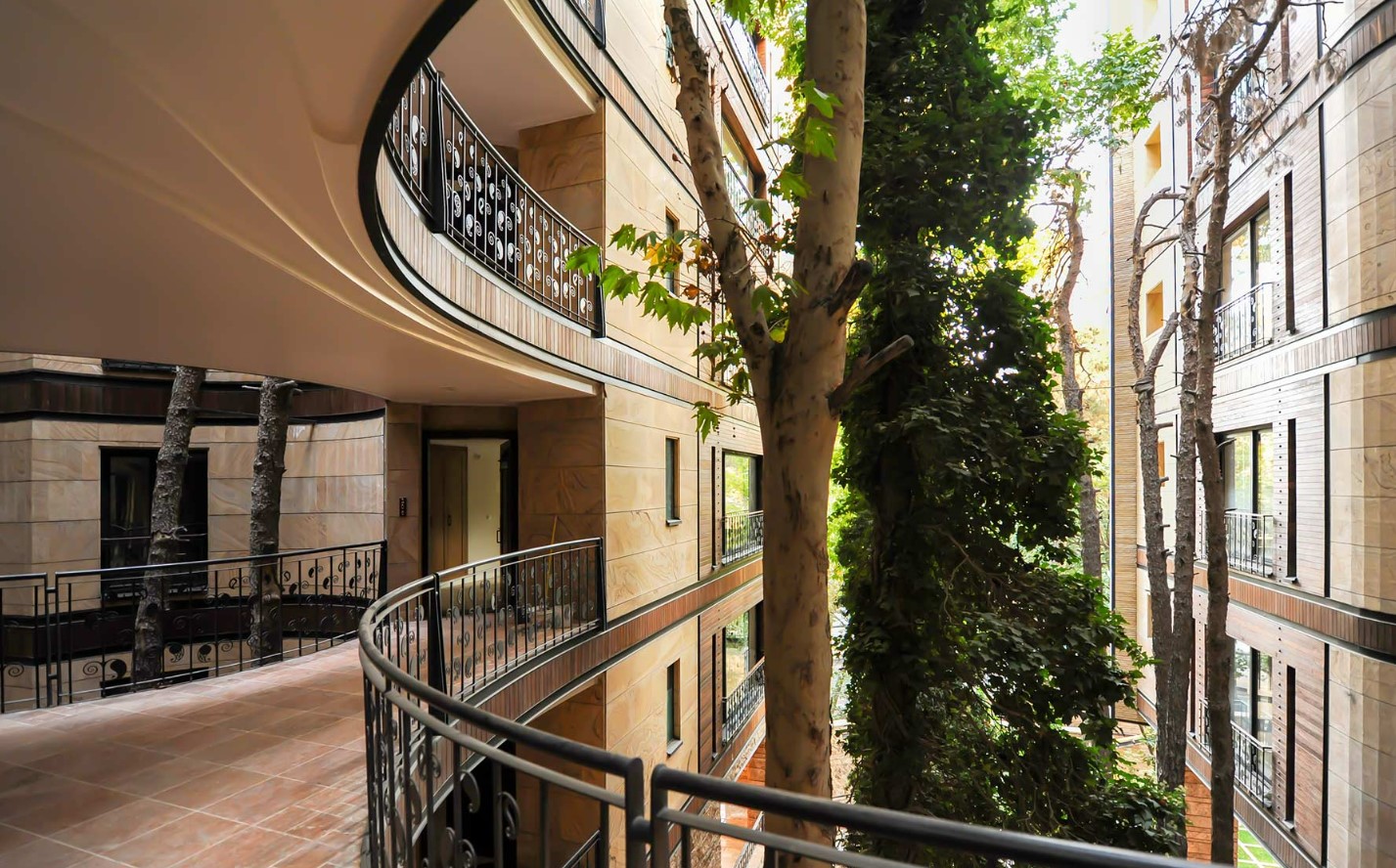 Niavaran Housing Complex: A Curved Building That Protects Old Trees