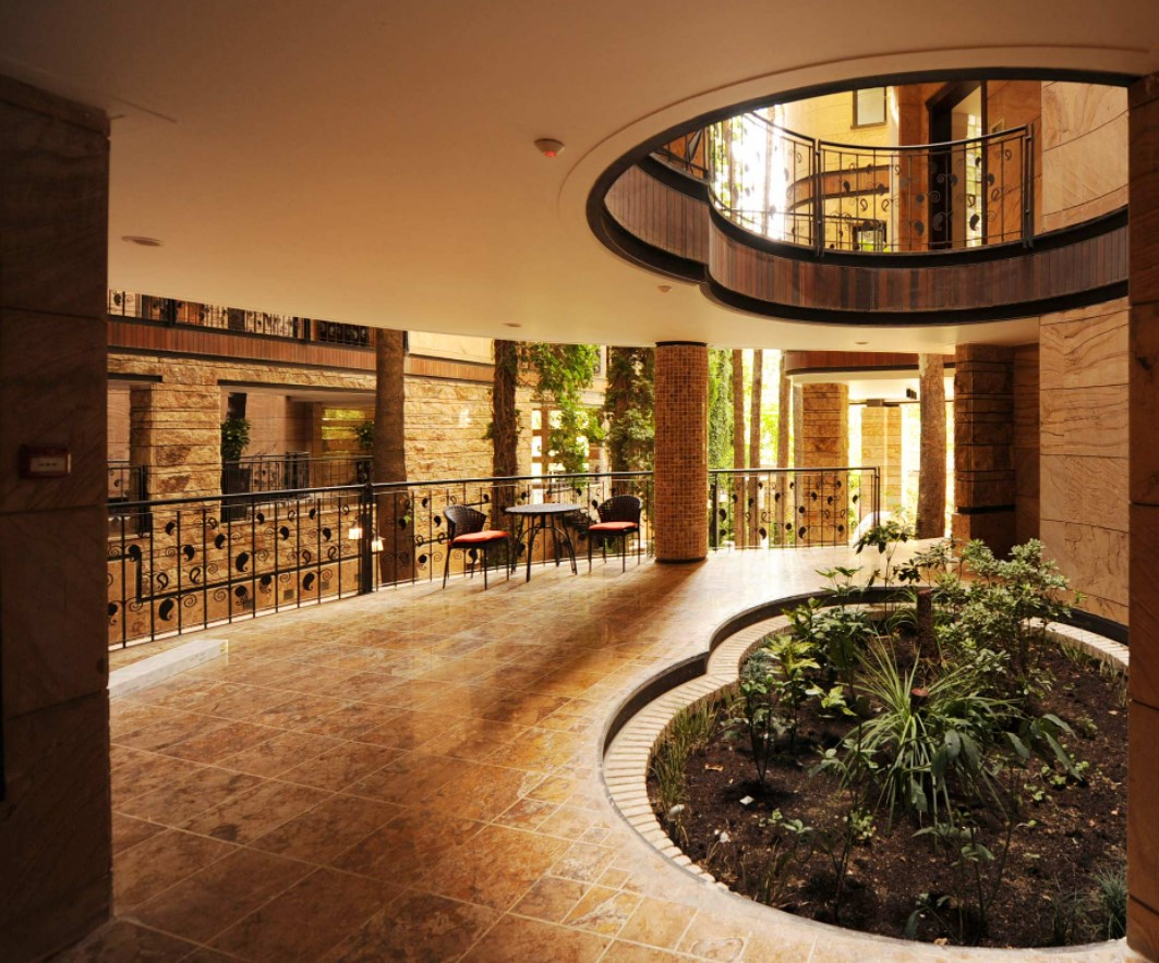 Niavaran Housing Complex: A Curved Building That Protects Old Trees